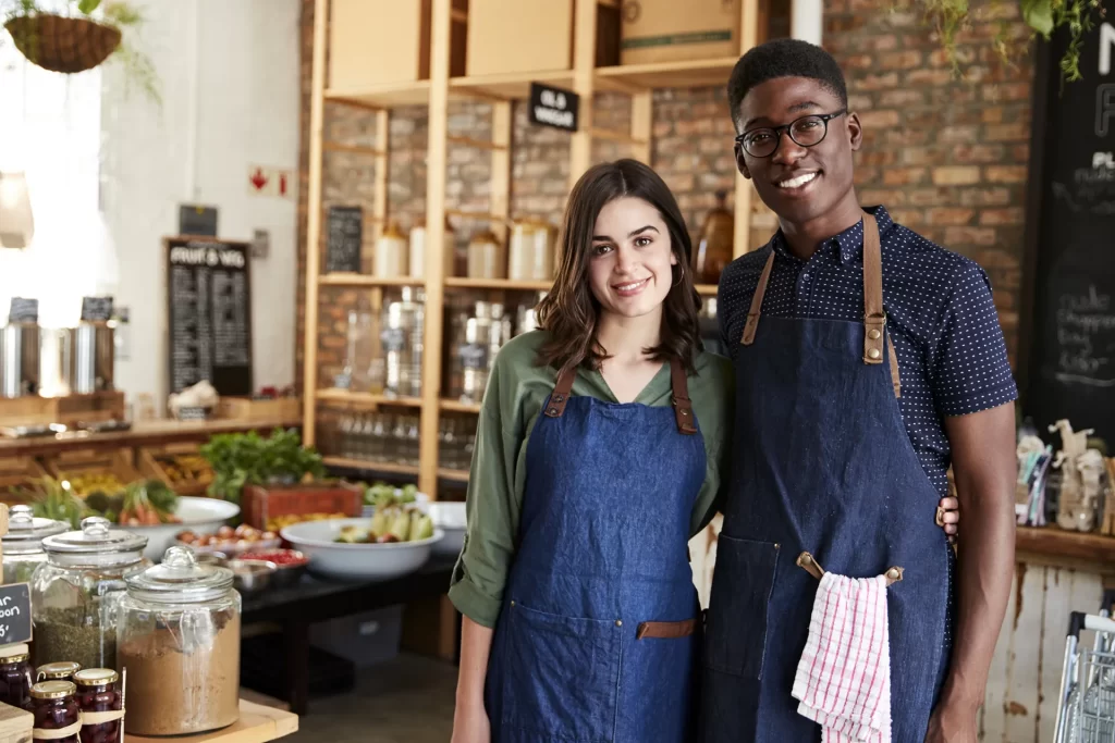 small business owners standing in their shop