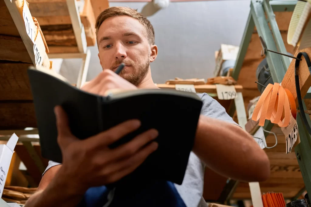 weatherization technician making notes for project