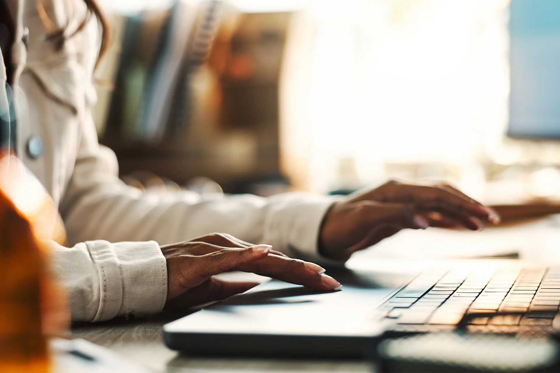 person using laptop to fill out sba 413 form